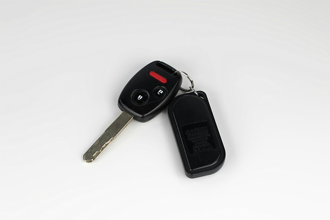 Car key with remote, illustrating ways to lower car insurance in Quebec