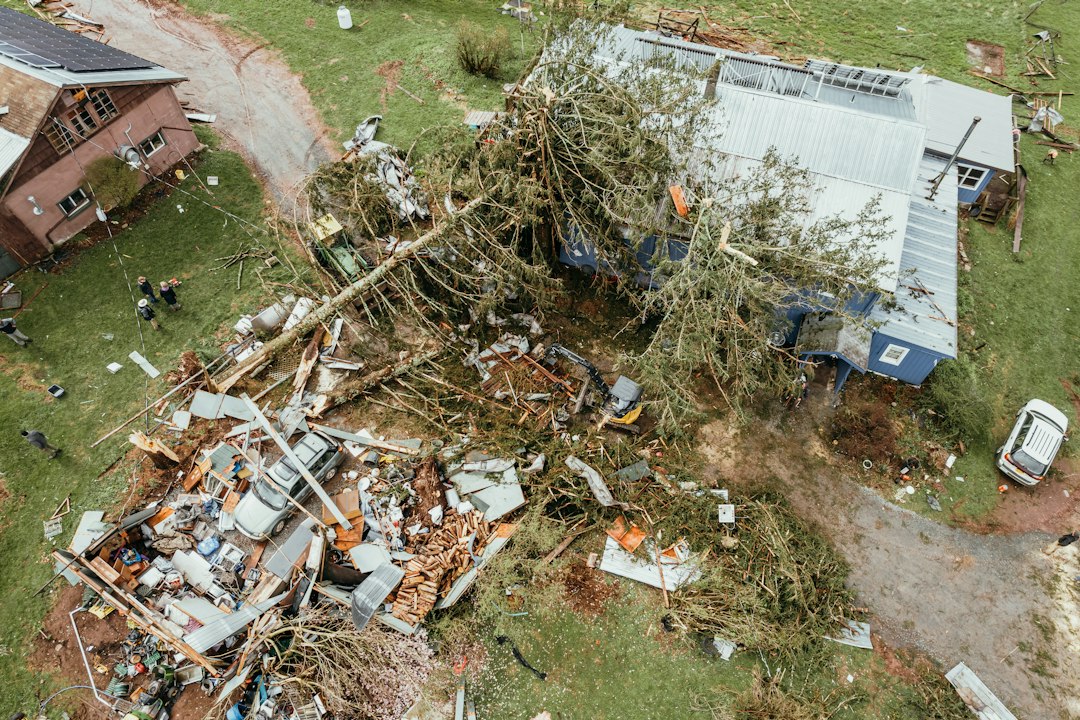Fallen tree on a damaged house after a storm, illustrating storm and tree damage home insurance in Quebec