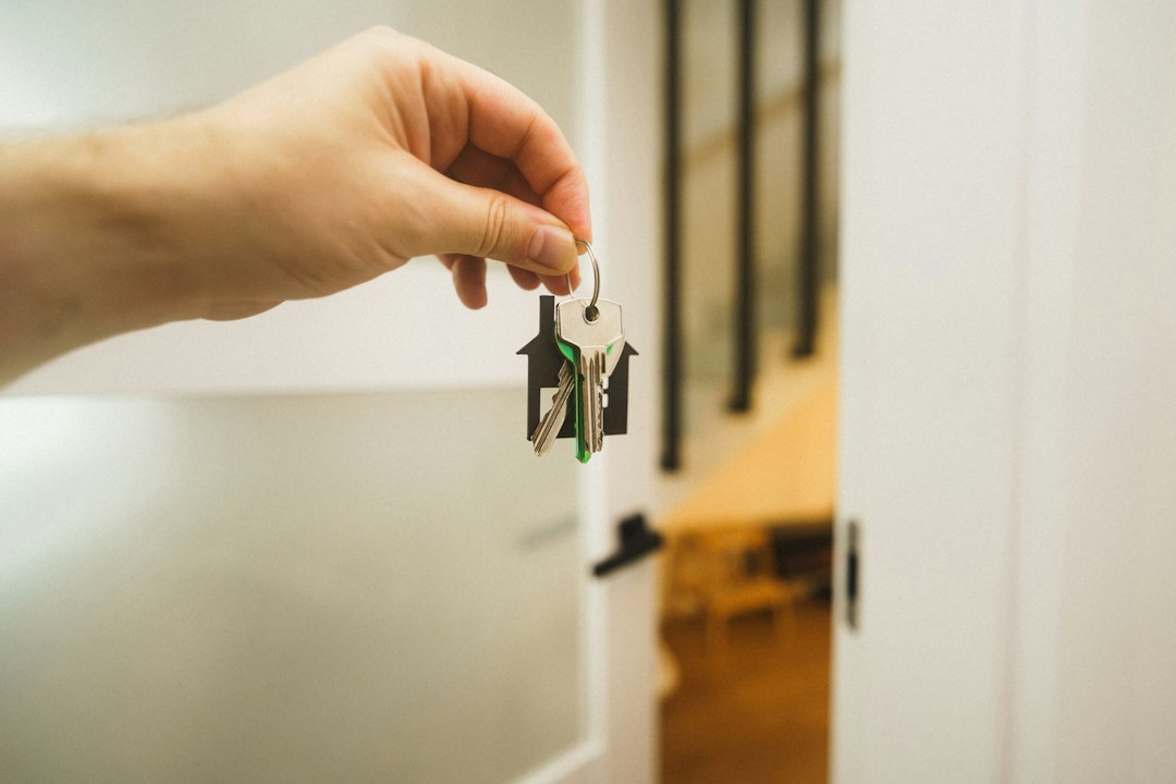 Keys handed over at the door of a new apartment, illustrating tenant insurance for renters in Quebec